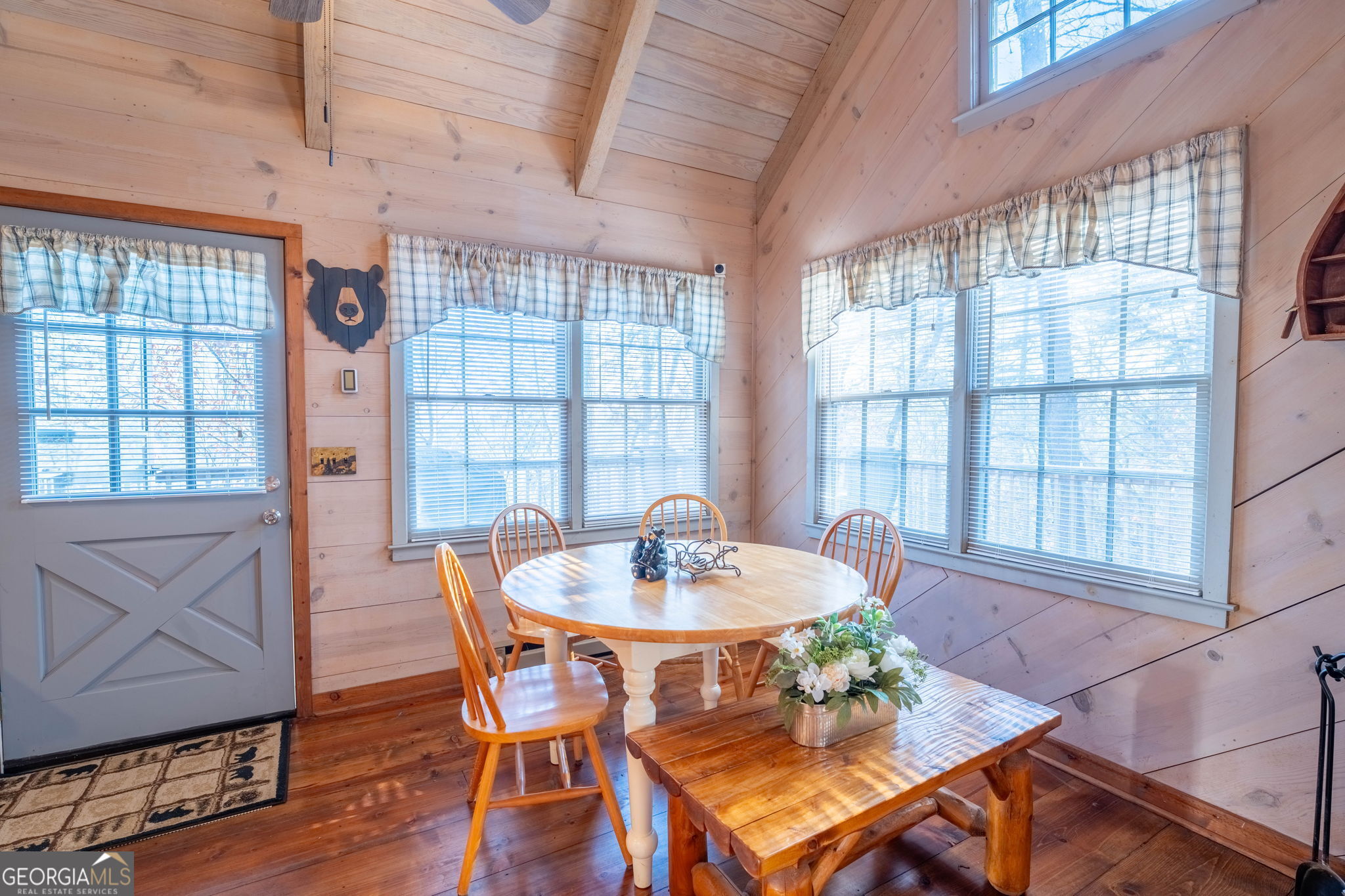 220 McConnell Court Helen, GA 30545 - Photo 16 of 37 a dining room with furniture a chandelier and wooden floor
