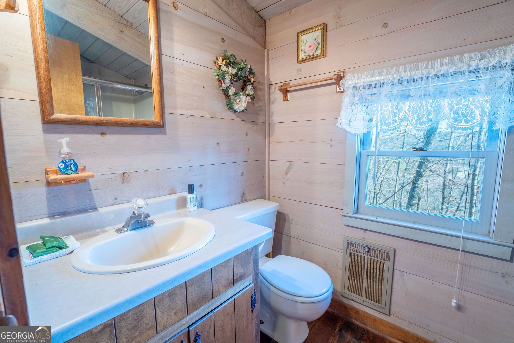 220 McConnell Court Helen, GA 30545 - Photo 18 of 37 a bathroom with a sink a toilet and a mirror