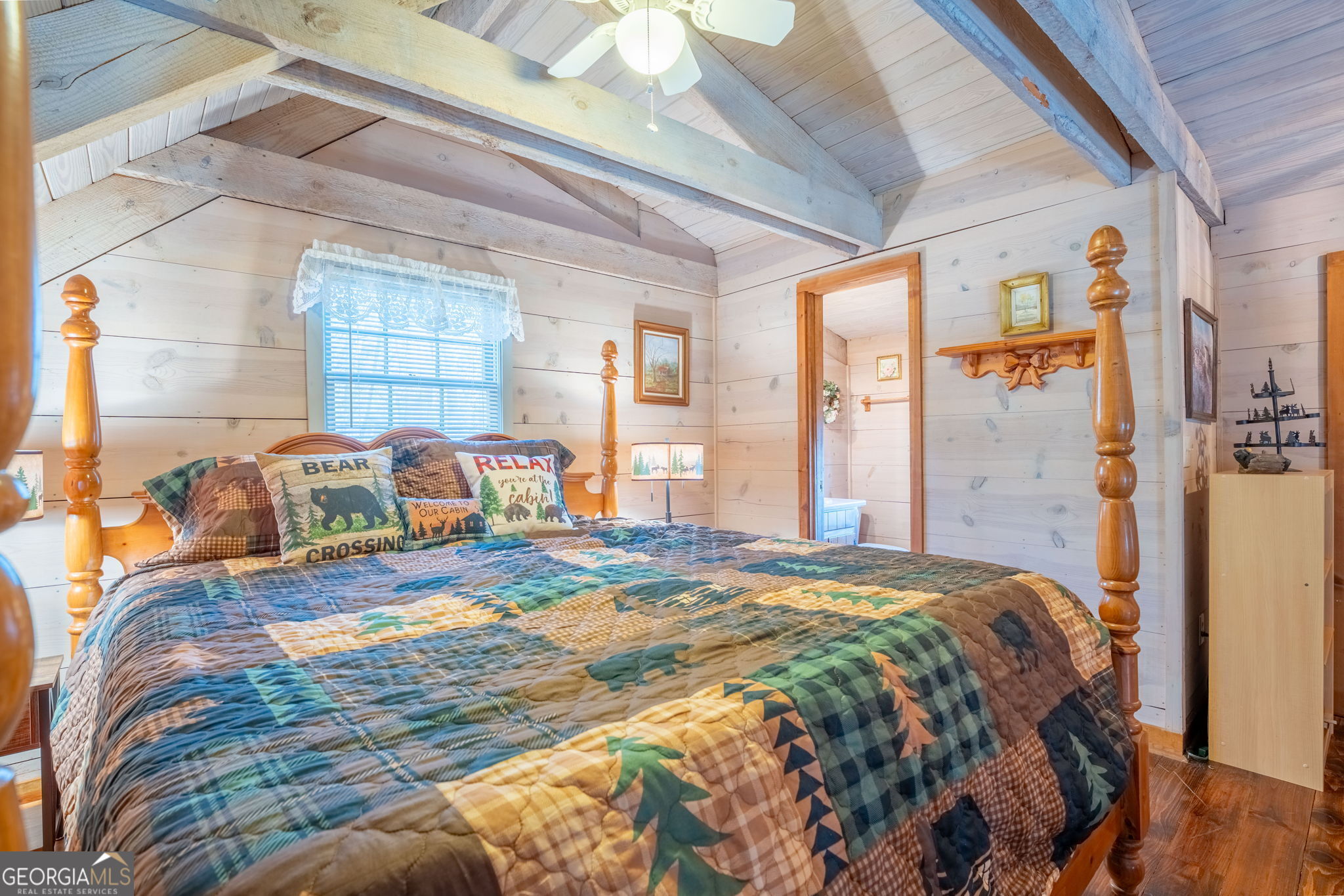 220 McConnell Court Helen, GA 30545 - Photo 19 of 37 a bed sitting in a bedroom next to a window