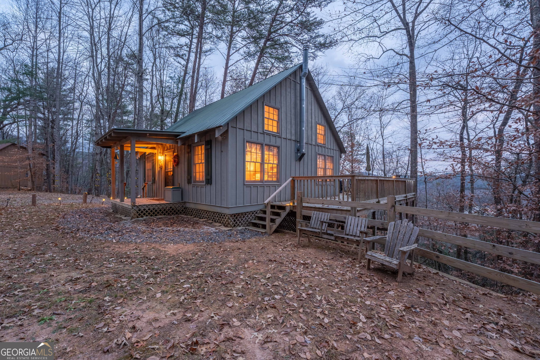 220 McConnell Court Helen, GA 30545 - Photo 4 of 37 a backyard of a house with barbeque oven and outdoor seating