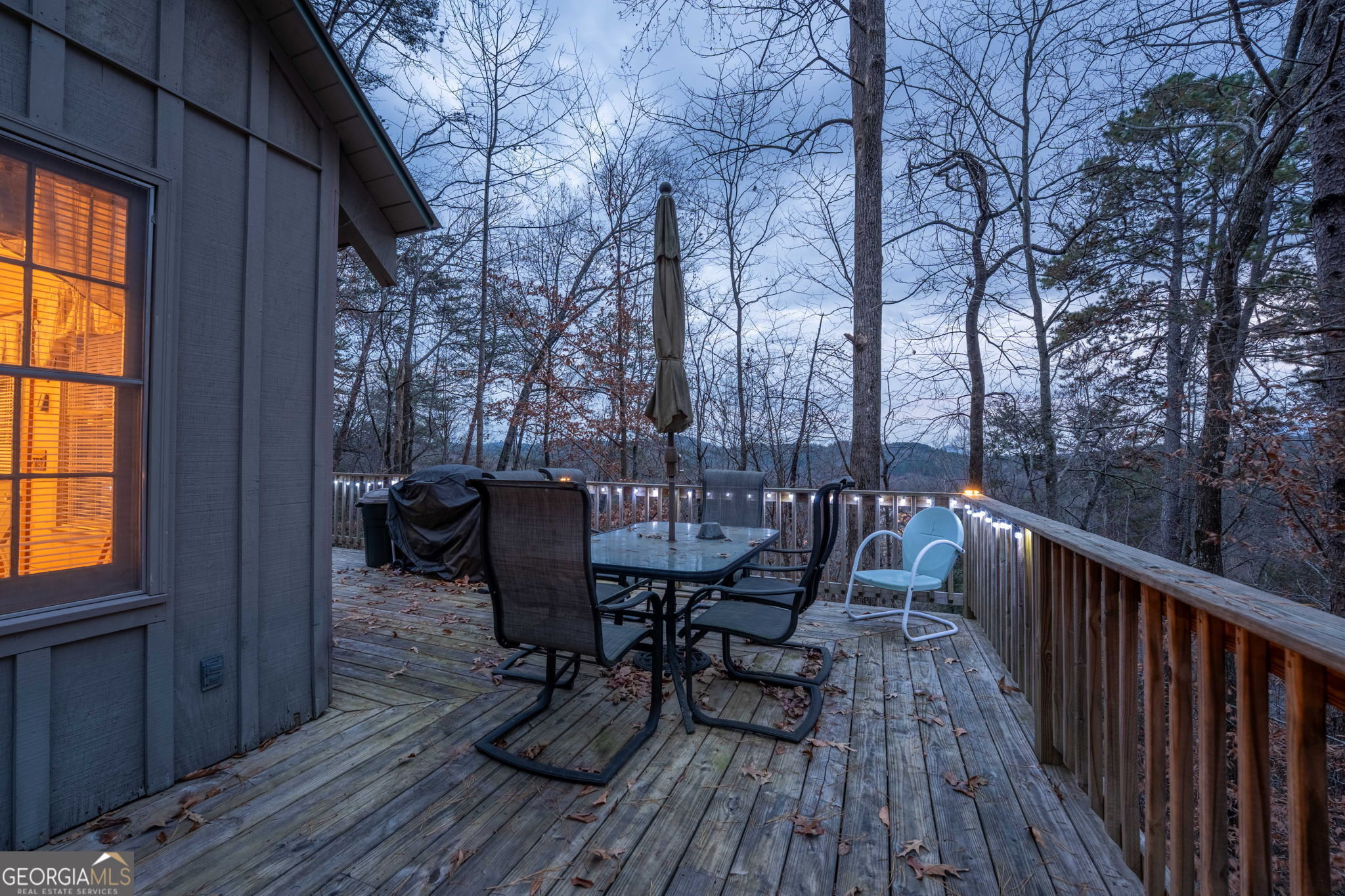 220 McConnell Court Helen, GA 30545 - Photo 7 of 37 a view of a deck with table and chairs and wooden floor