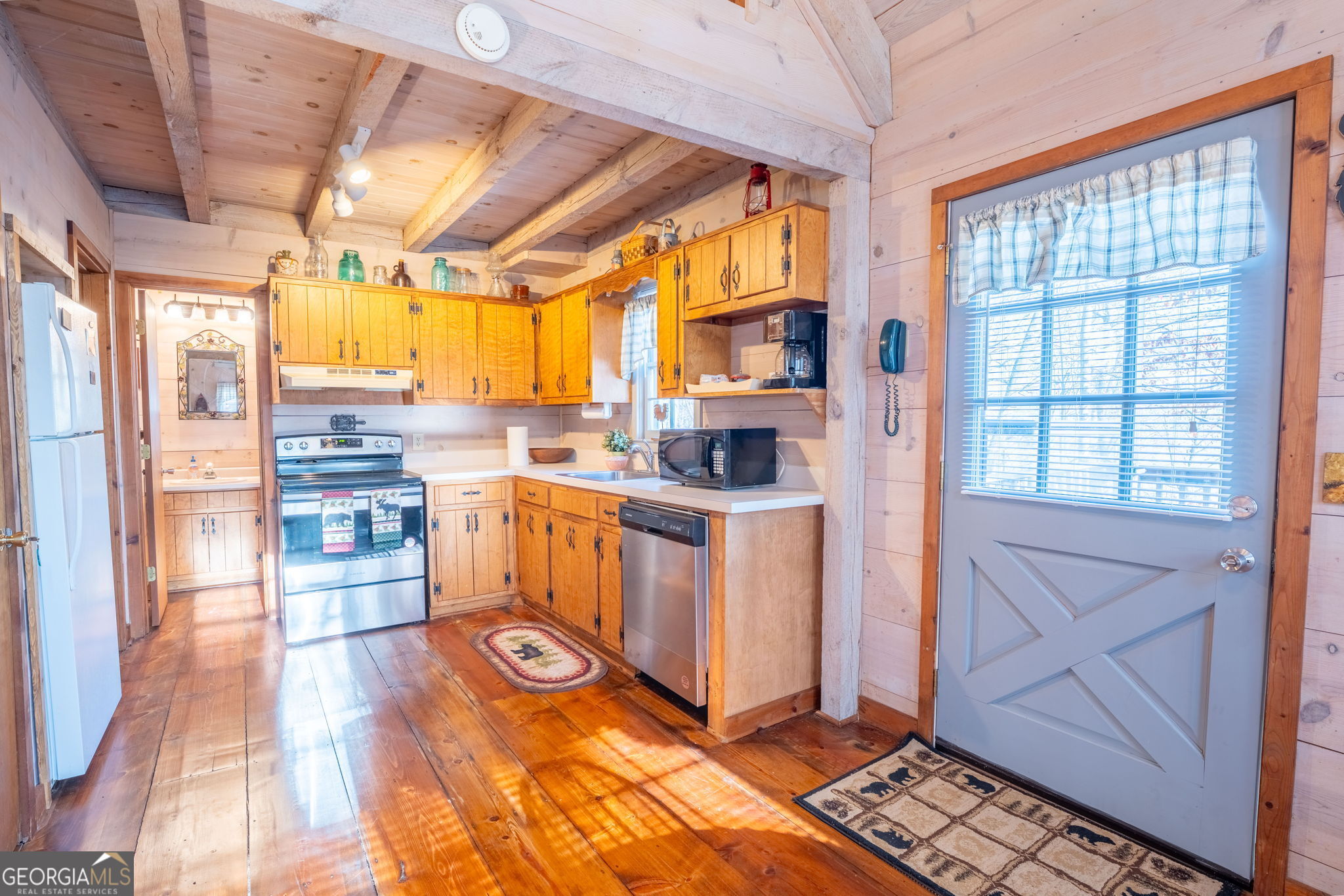 220 McConnell Court Helen, GA 30545 - Photo 8 of 37 a view of a kitchen with fridge and wooden floor
