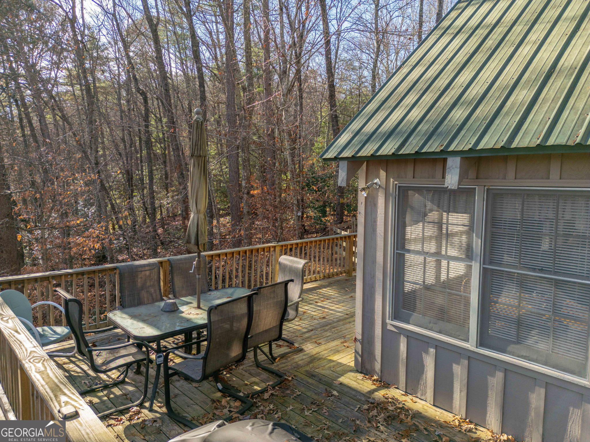 220 McConnell Court Helen, GA 30545 - Photo 9 of 37 a view of a chairs and table on the deck