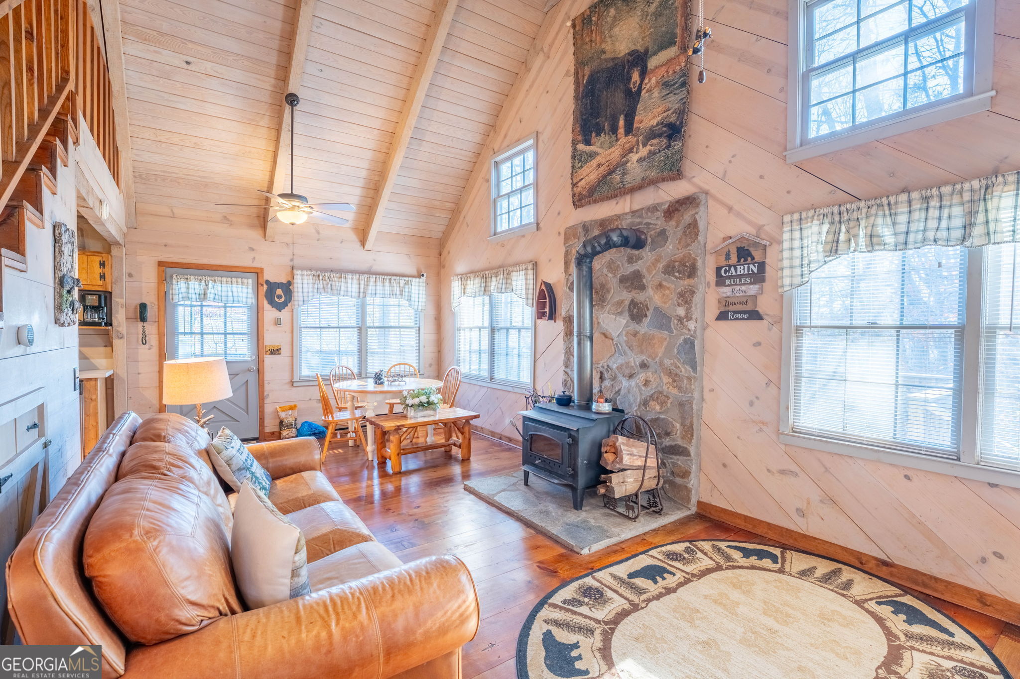 220 McConnell Court Helen, GA 30545 - Photo 10 of 37 a living room with fireplace furniture and a large window