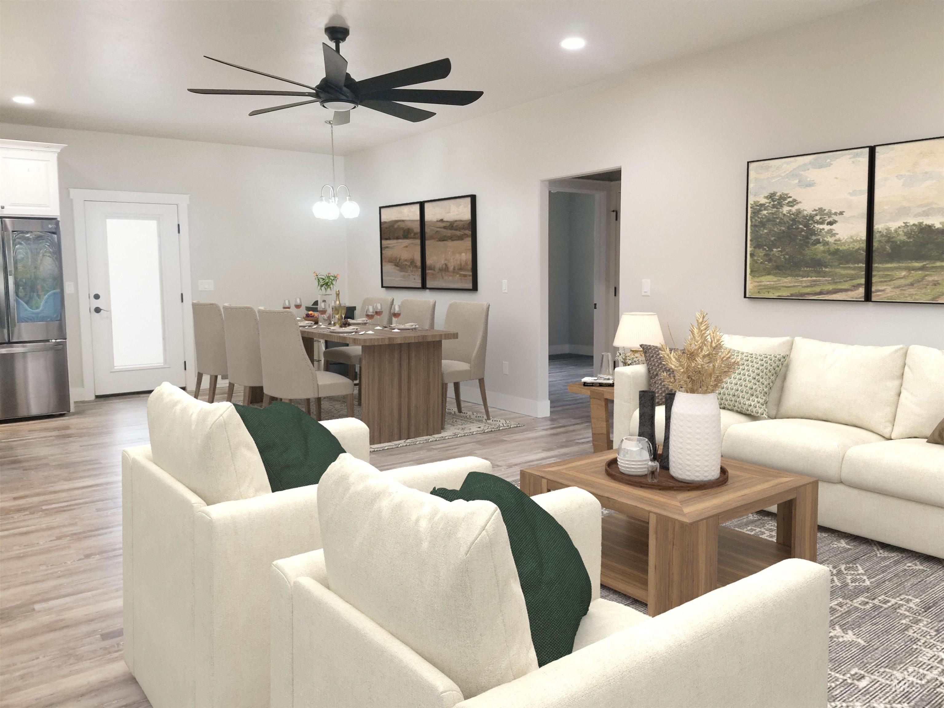 Living area featuring recessed lighting, light wood-style floors, ceiling fan, and a chandelier