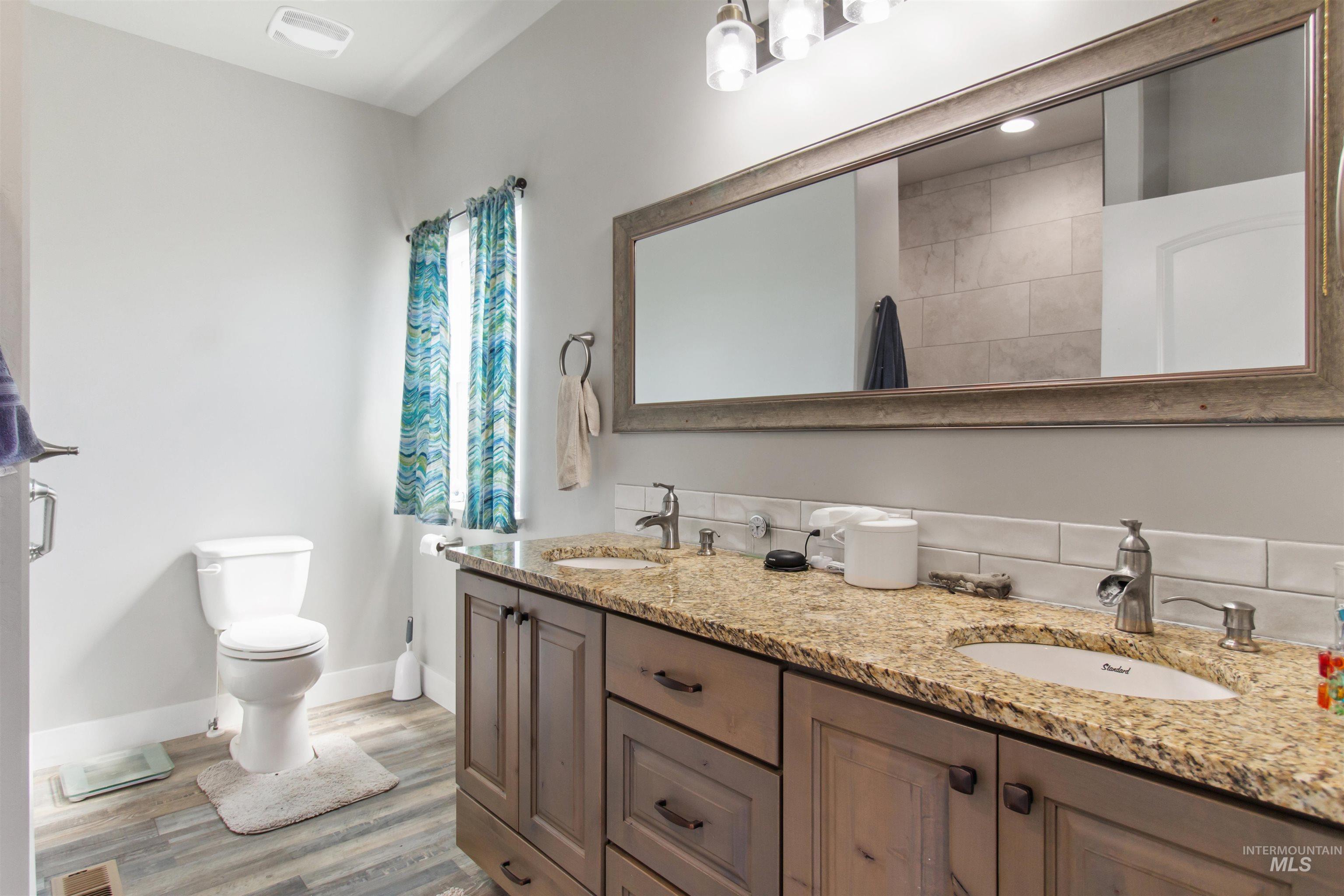 212 Fafnir Drive Kimberly, ID 83341 - Photo 16 of 36 Bathroom featuring light wood-type flooring and double vanity