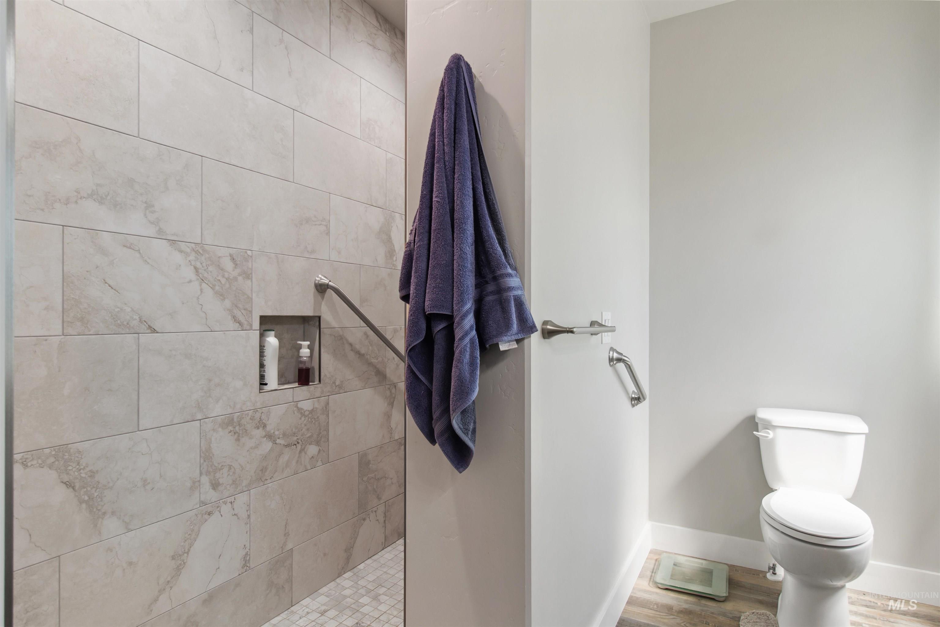 212 Fafnir Drive Kimberly, ID 83341 - Photo 17 of 36 Full bathroom with a walk in shower and wood finished floors