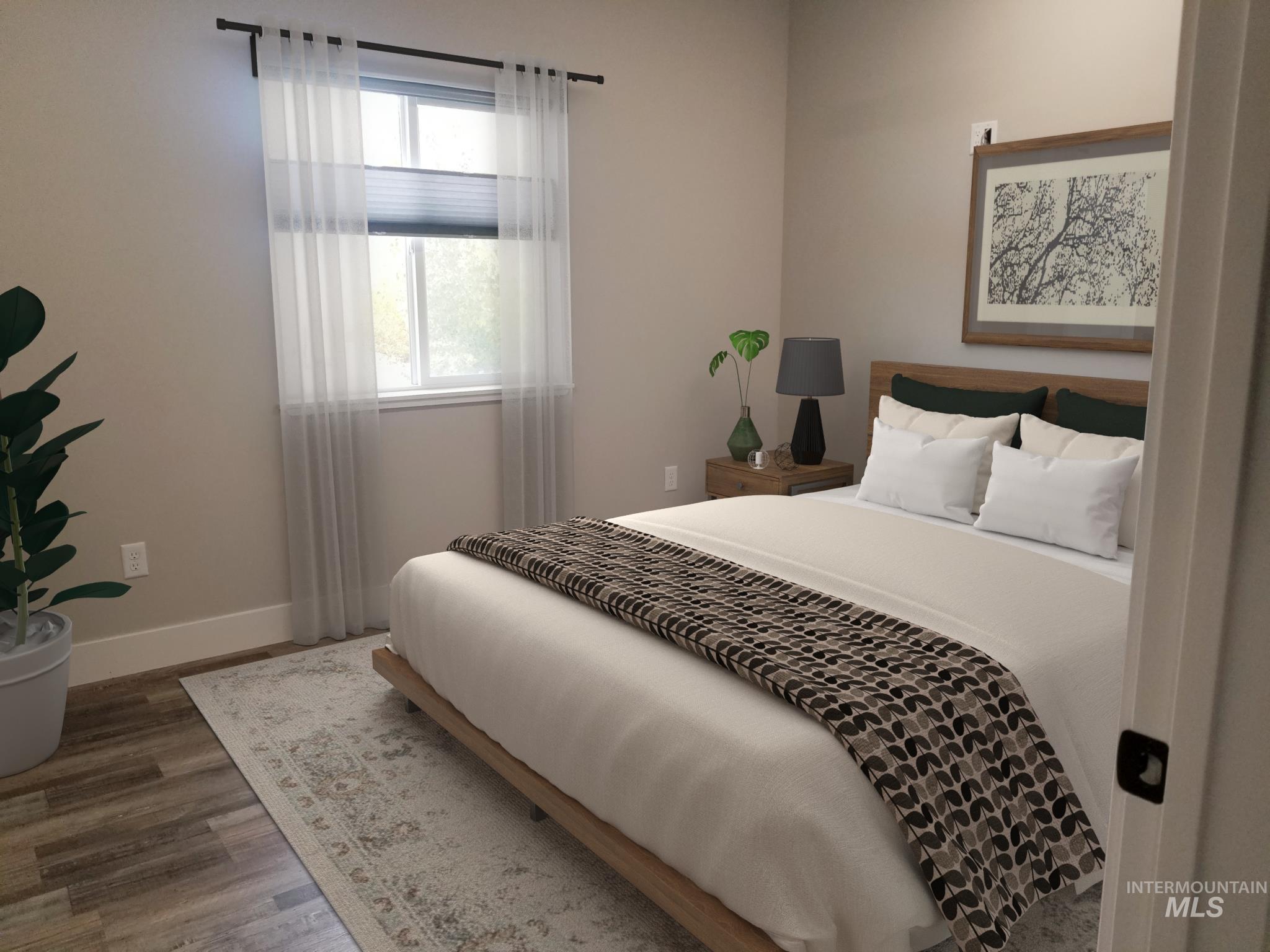 212 Fafnir Drive Kimberly, ID 83341 - Photo 19 of 36 Bedroom with wood finished floors and baseboards