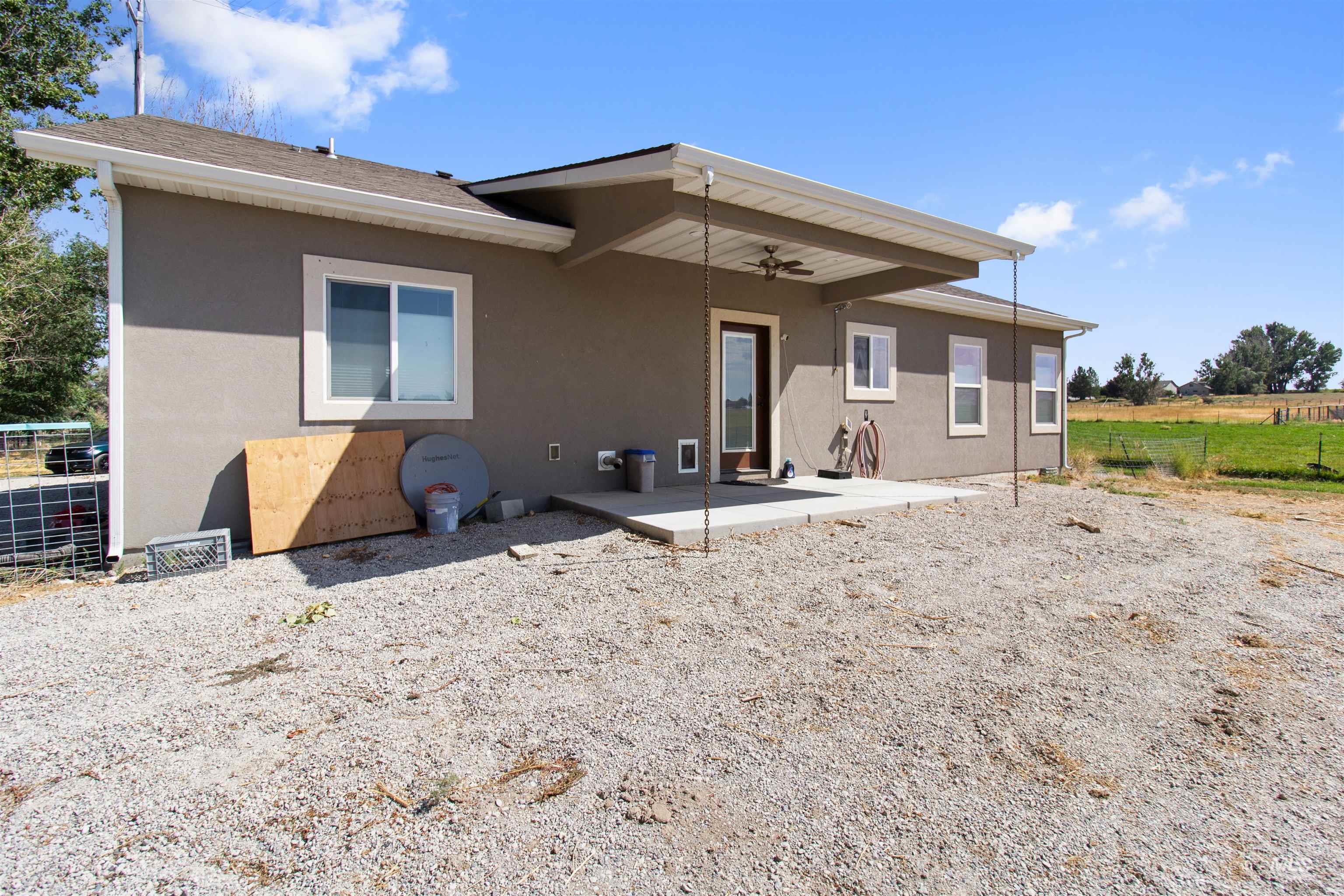 212 Fafnir Drive Kimberly, ID 83341 - Photo 27 of 36 Rear view of house featuring a patio area, stucco siding, and ceiling fan