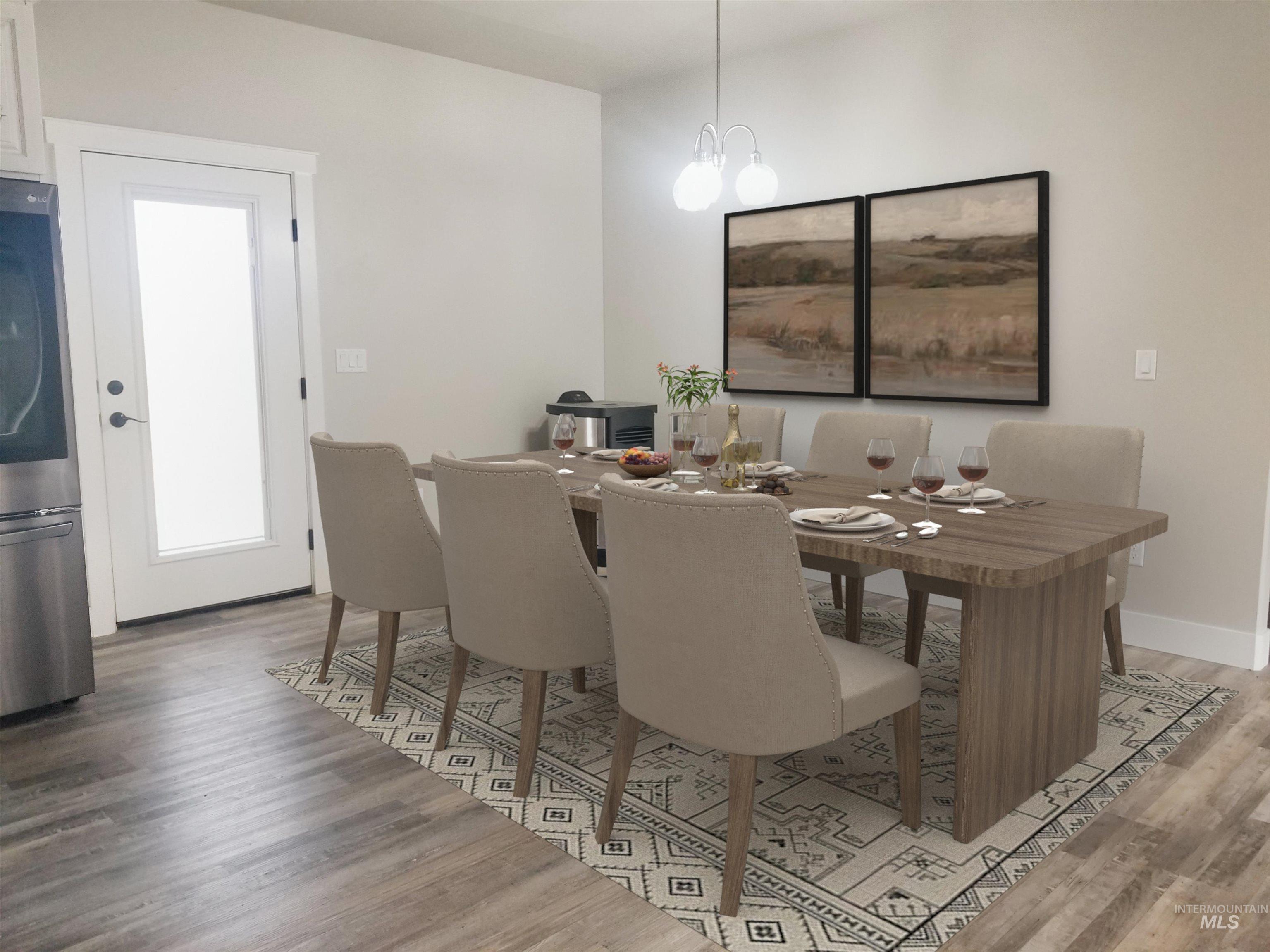 212 Fafnir Drive Kimberly, ID 83341 - Photo 10 of 36 Dining area featuring light wood finished floors and a chandelier