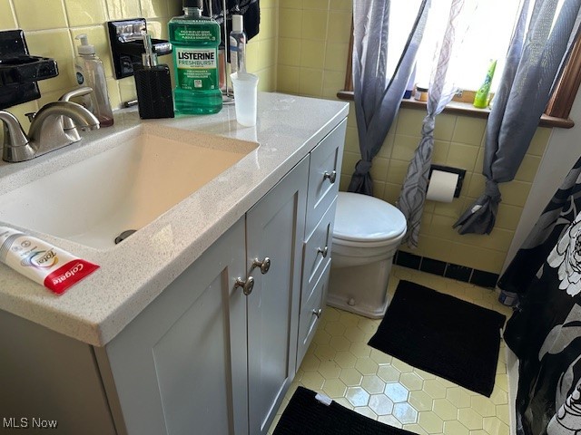 3832 Wallingford Road South Euclid, OH 44121 - Photo 11 of 16 Bathroom featuring tile patterned flooring, vanity, toilet, and tile walls