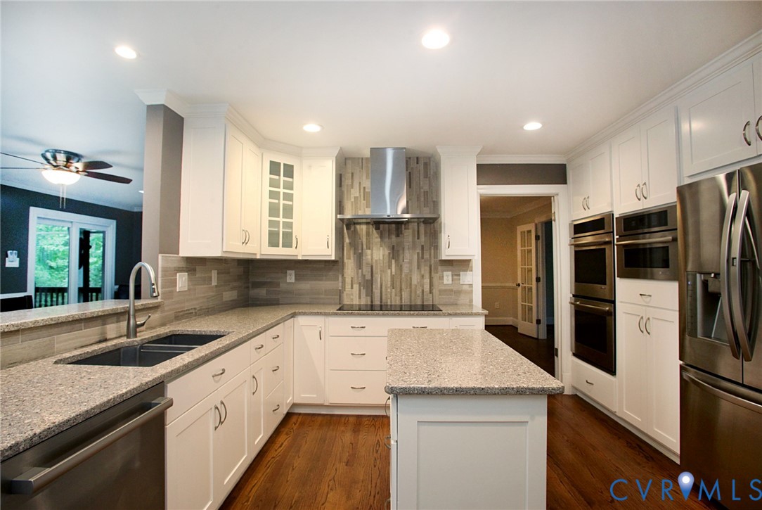 231 Hazelmere Drive Chesterfield, VA 23236 - Photo 7 of 33 a kitchen that has a sink a refrigerator and a sink