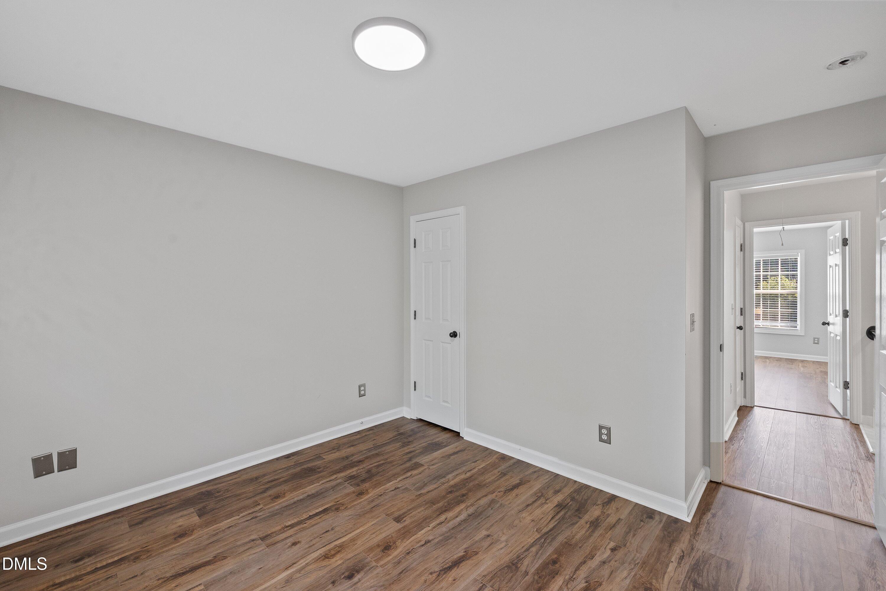 3717 Windmeade Road Wake Forest, NC 27587 - Photo 45 of 51 a view of a room with wooden floor
