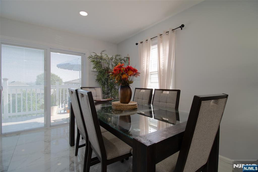 88 Columbia Street Wood-Ridge, NJ 07075 - Photo 13 of 32 a view of a dining room with furniture window and wooden floor