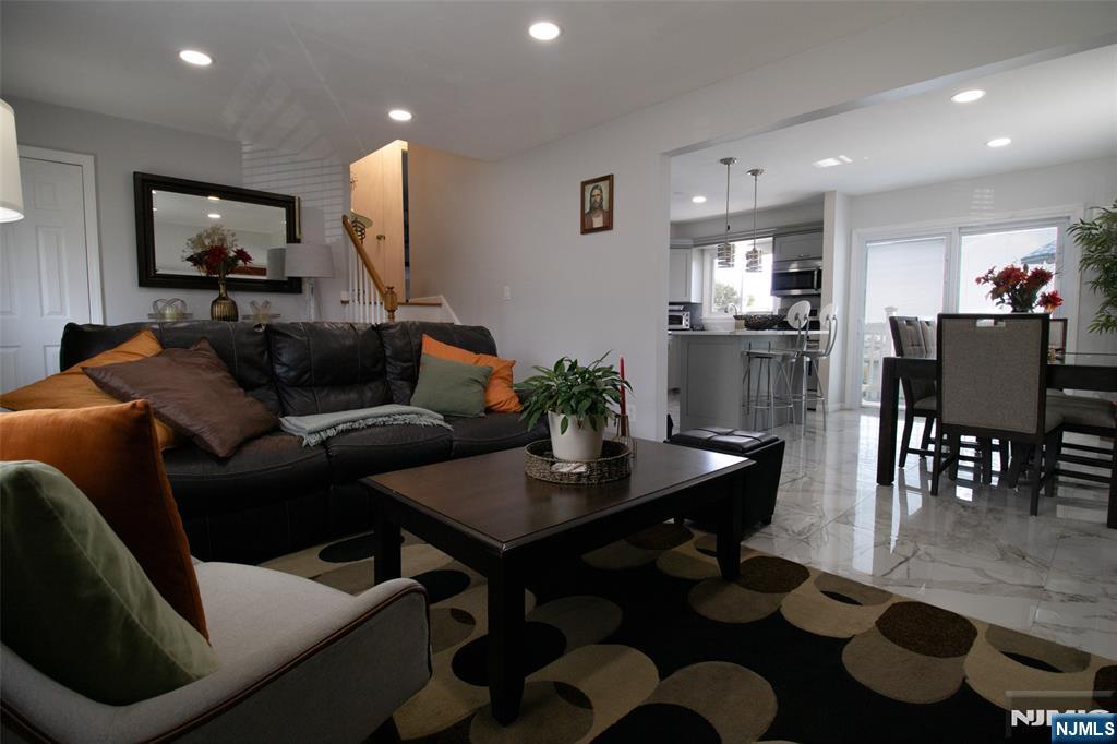 88 Columbia Street Wood-Ridge, NJ 07075 - Photo 15 of 32 a living room with furniture and a flat screen tv
