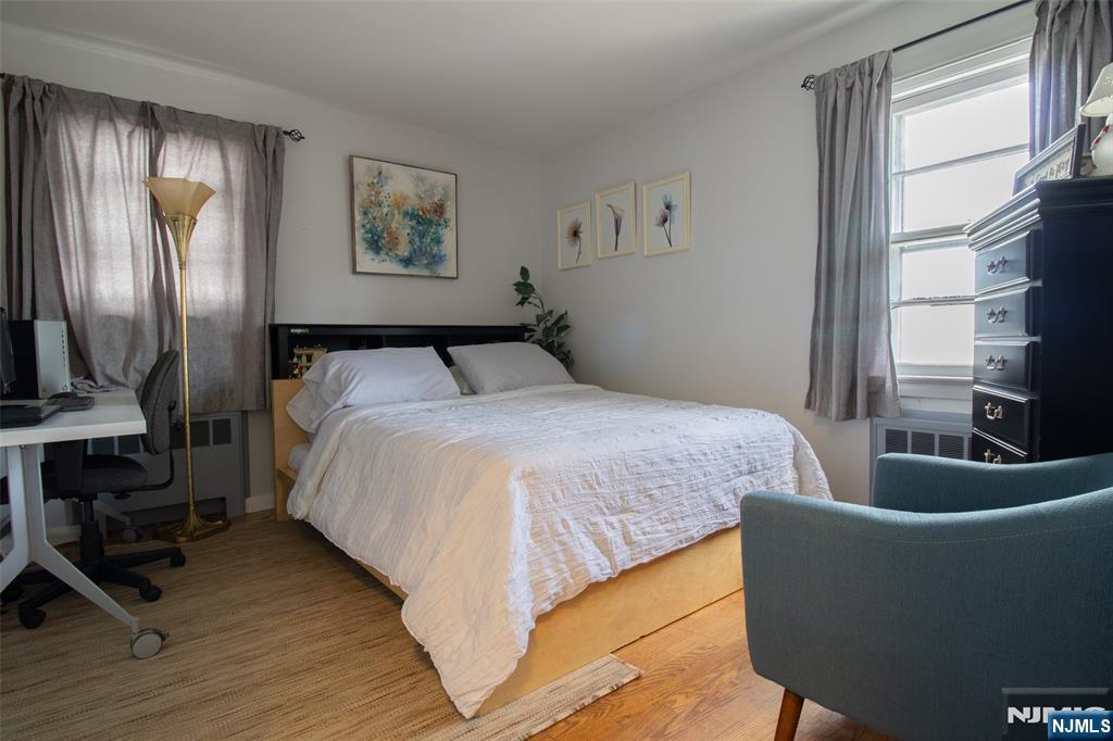 88 Columbia Street Wood-Ridge, NJ 07075 - Photo 19 of 32 a bed sitting in a bedroom next to a window