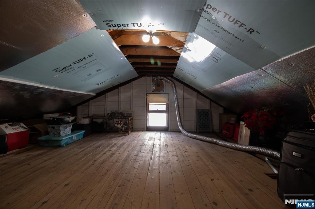 88 Columbia Street Wood-Ridge, NJ 07075 - Photo 32 of 32 a living room with lots of furniture and wooden floors