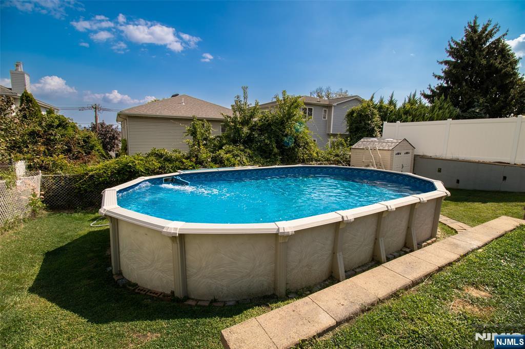 88 Columbia Street Wood-Ridge, NJ 07075 - Photo 4 of 32 a view of a swimming pool with a patio