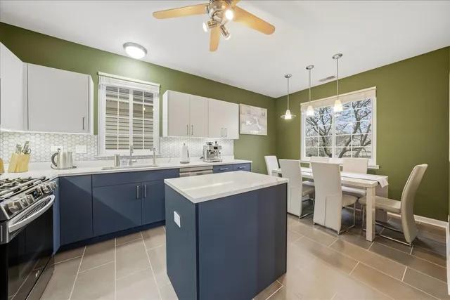 a kitchen with sink cabinets and window