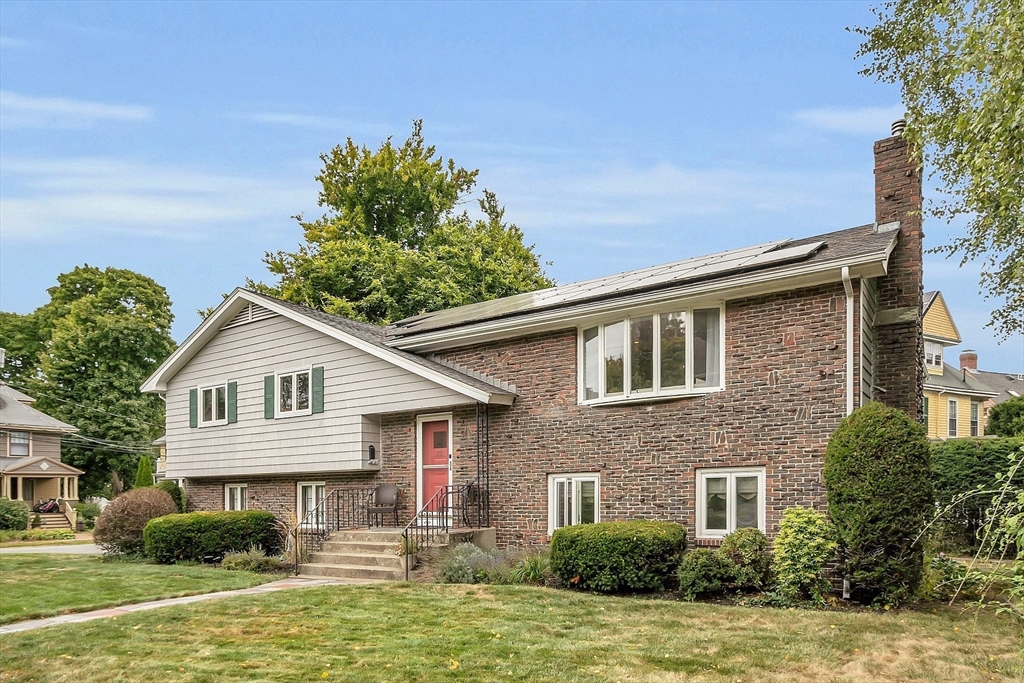75 Nonantum Street Newton, MA 02458 - Photo 1 of 41 a front view of a house with a yard