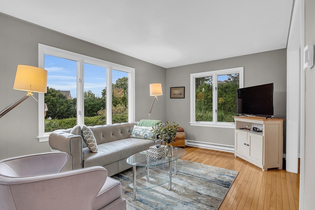 75 Nonantum Street Newton, MA 02458 - Photo 11 of 41 a living room with furniture and a flat screen tv
