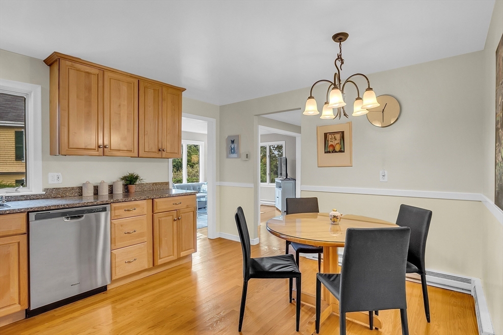 75 Nonantum Street Newton, MA 02458 - Photo 13 of 41 a view of a dining room with furniture wooden floor and chandelier