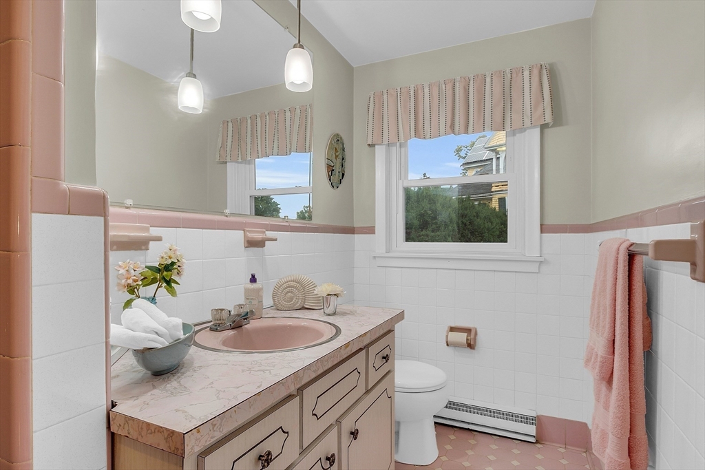 75 Nonantum Street Newton, MA 02458 - Photo 17 of 41 a bathroom with a sink toilet and mirror