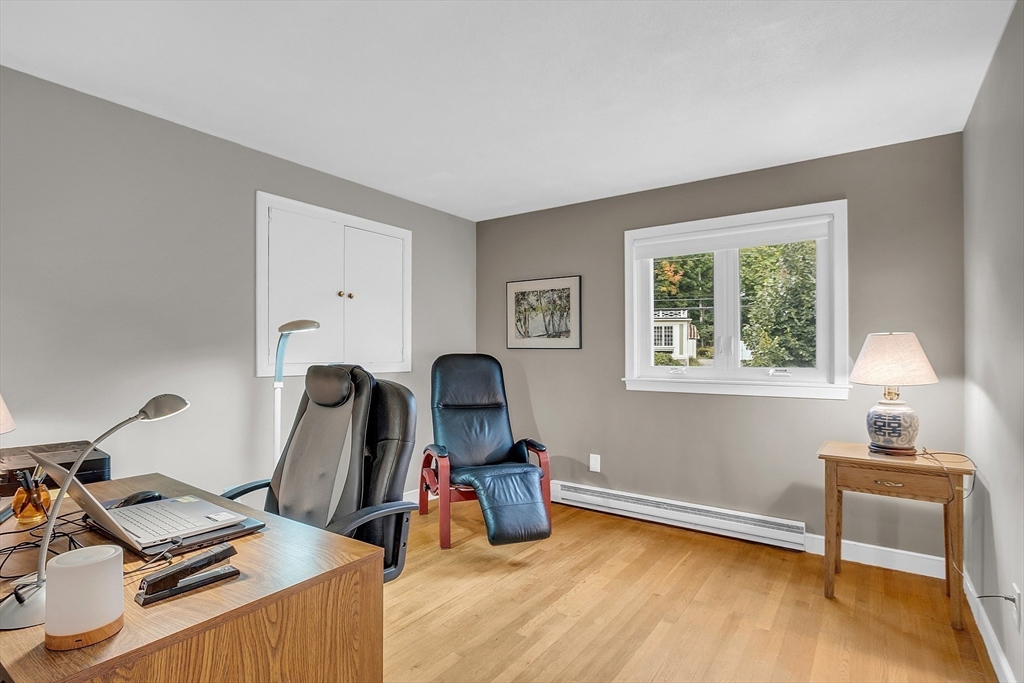 75 Nonantum Street Newton, MA 02458 - Photo 18 of 41 a view of a workspace with furniture and a window