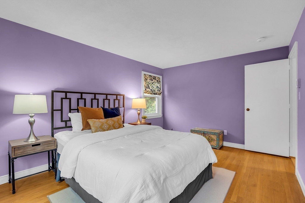 75 Nonantum Street Newton, MA 02458 - Photo 20 of 41 a bedroom with a bed and lamp on table