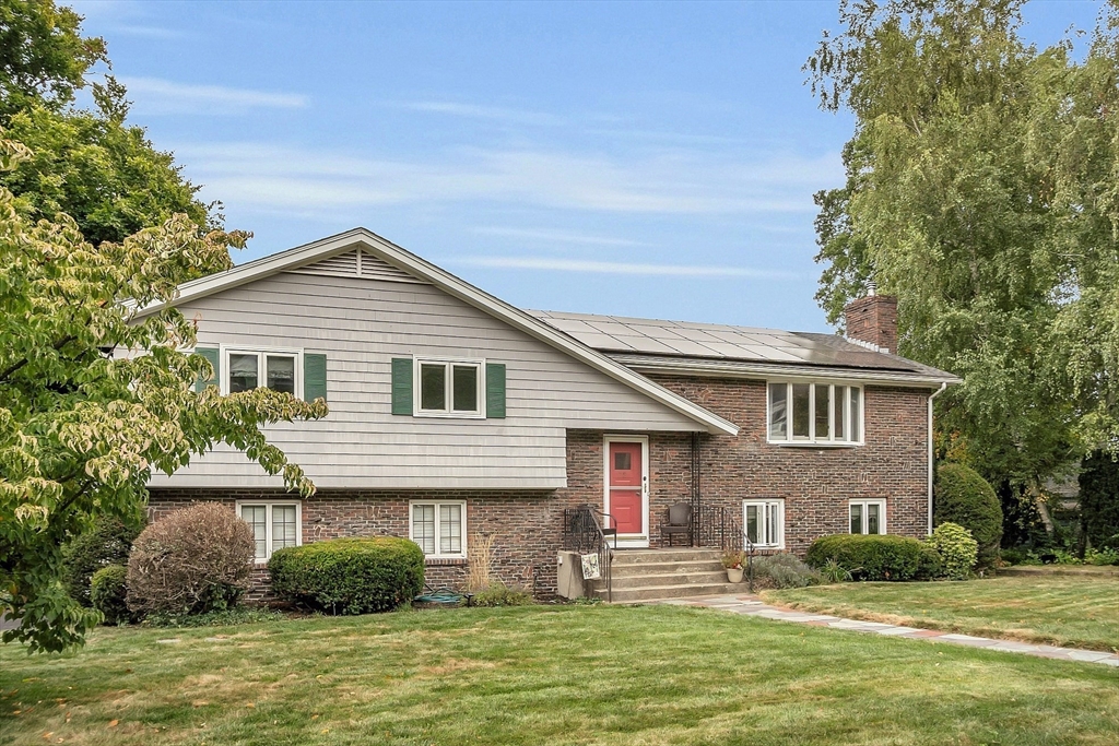 75 Nonantum Street Newton, MA 02458 - Photo 2 of 41 a front view of a house with a garden