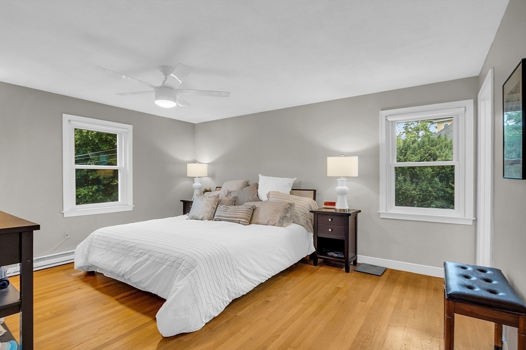 75 Nonantum Street Newton, MA 02458 - Photo 21 of 41 a bedroom with a bed and wooden floor