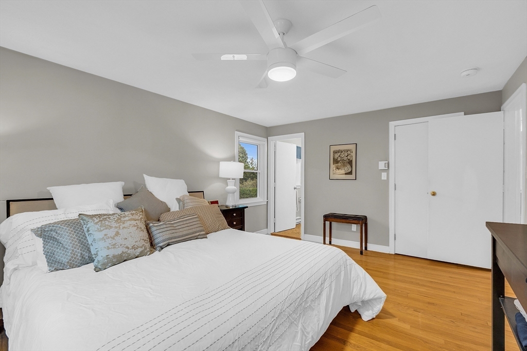 75 Nonantum Street Newton, MA 02458 - Photo 22 of 41 a bedroom with a bed and wooden floor