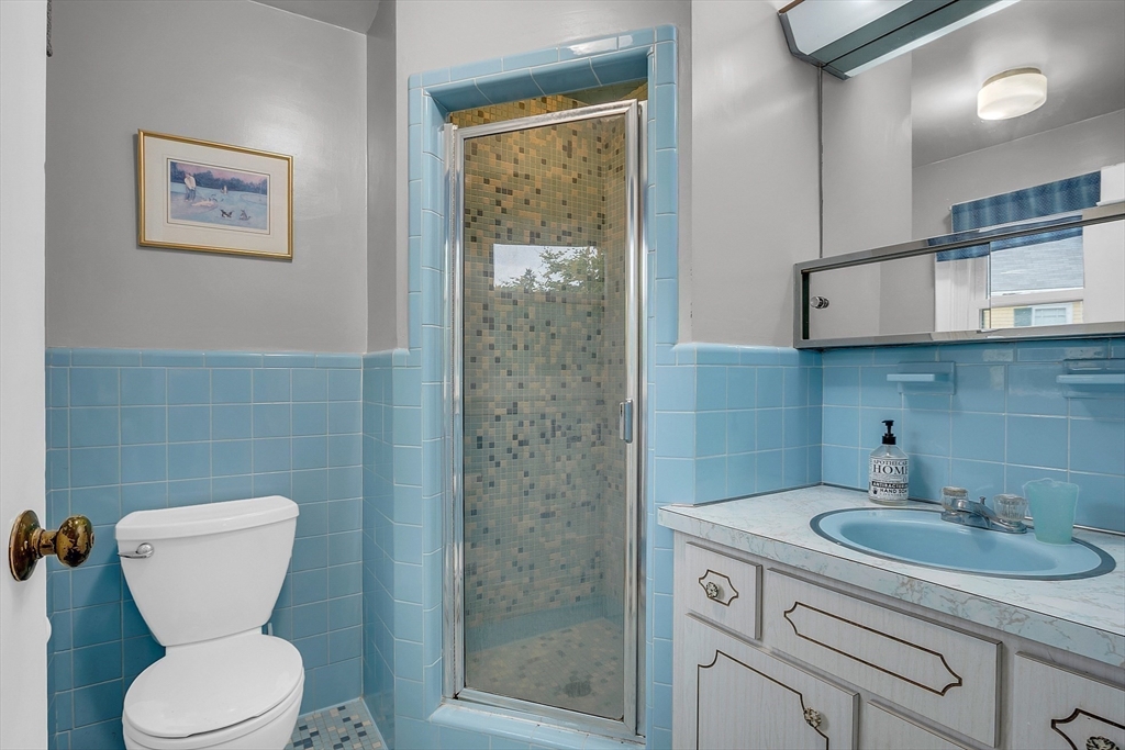 75 Nonantum Street Newton, MA 02458 - Photo 23 of 41 a bathroom with a toilet sink and mirror