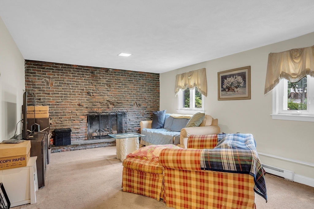 75 Nonantum Street Newton, MA 02458 - Photo 24 of 41 a bedroom with furniture and a fireplace