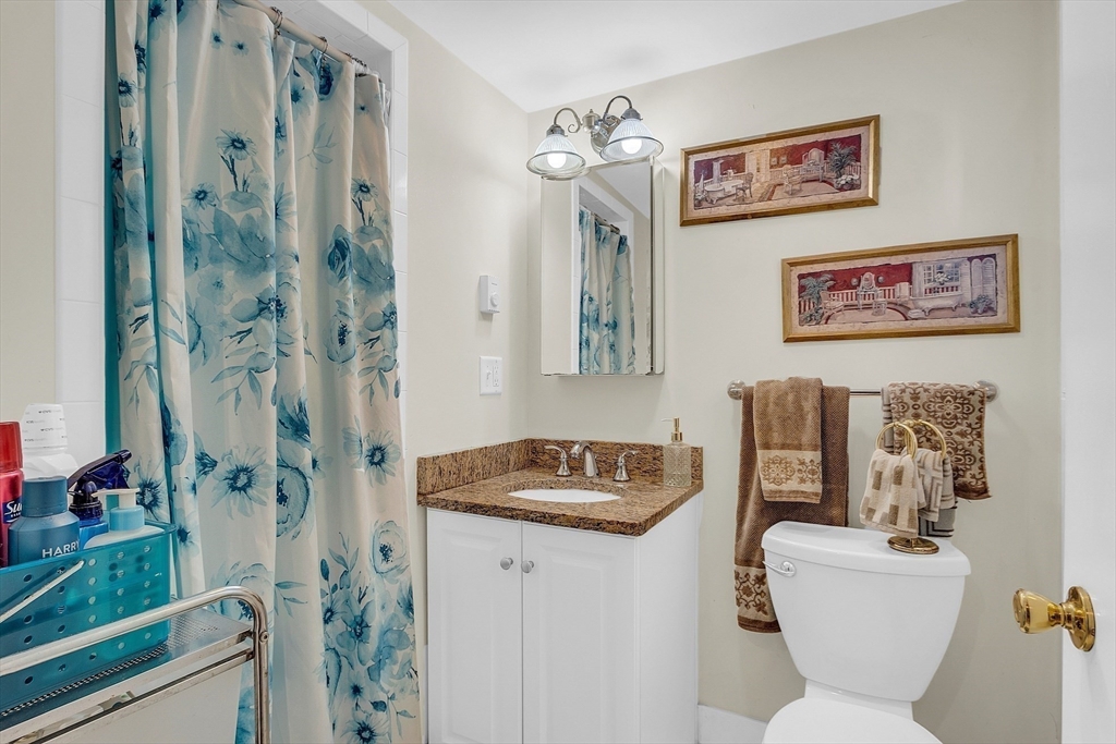 75 Nonantum Street Newton, MA 02458 - Photo 28 of 41 a bathroom with a toilet sink and shower