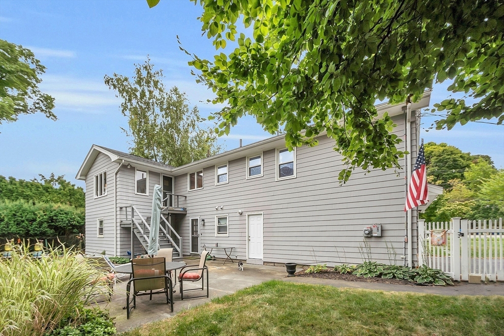 75 Nonantum Street Newton, MA 02458 - Photo 4 of 41 a white house with a big yard and large trees