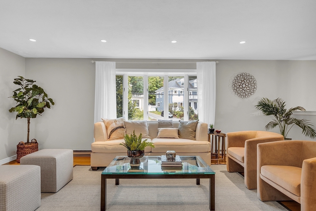 75 Nonantum Street Newton, MA 02458 - Photo 8 of 41 a living room with furniture and a large window