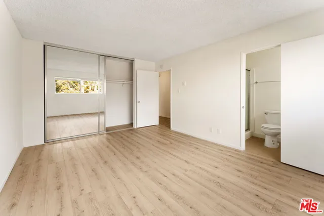 a view of an empty room and a sink