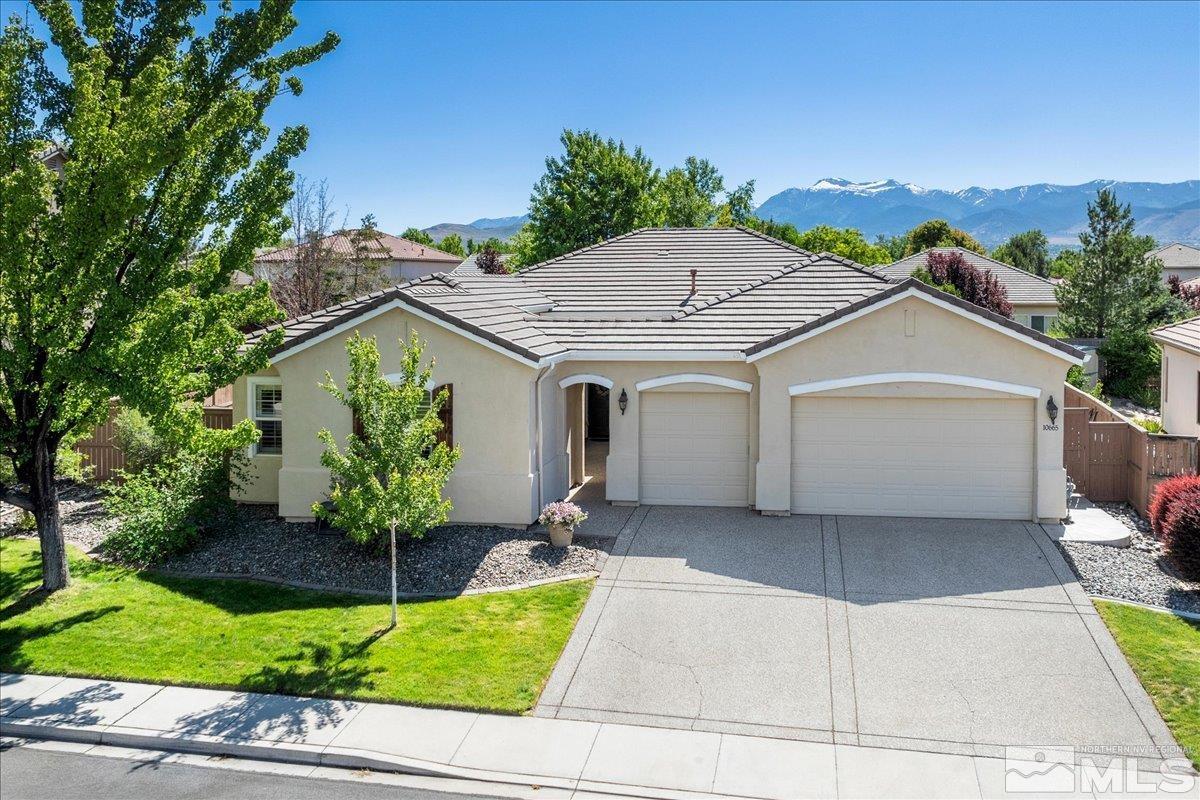 10665 Autumn Walk Lane Reno, NV 89521 - Photo 1 of 35 a front view of a house with garden