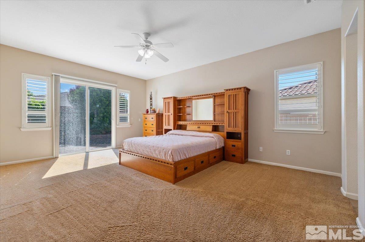 10665 Autumn Walk Lane Reno, NV 89521 - Photo 15 of 35 a bedroom with a large bed and a large window