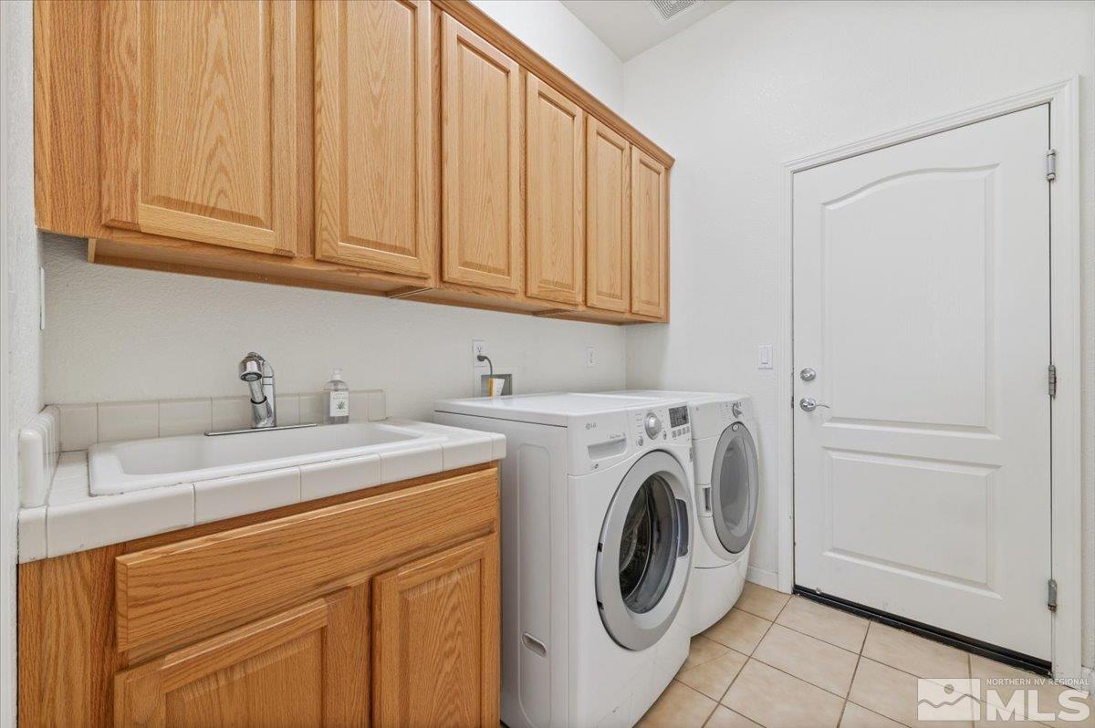 10665 Autumn Walk Lane Reno, NV 89521 - Photo 24 of 35 a utility room with sink dryer and washer