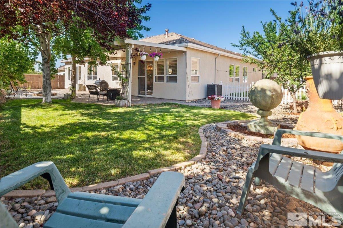 10665 Autumn Walk Lane Reno, NV 89521 - Photo 26 of 35 a front view of a house with garden
