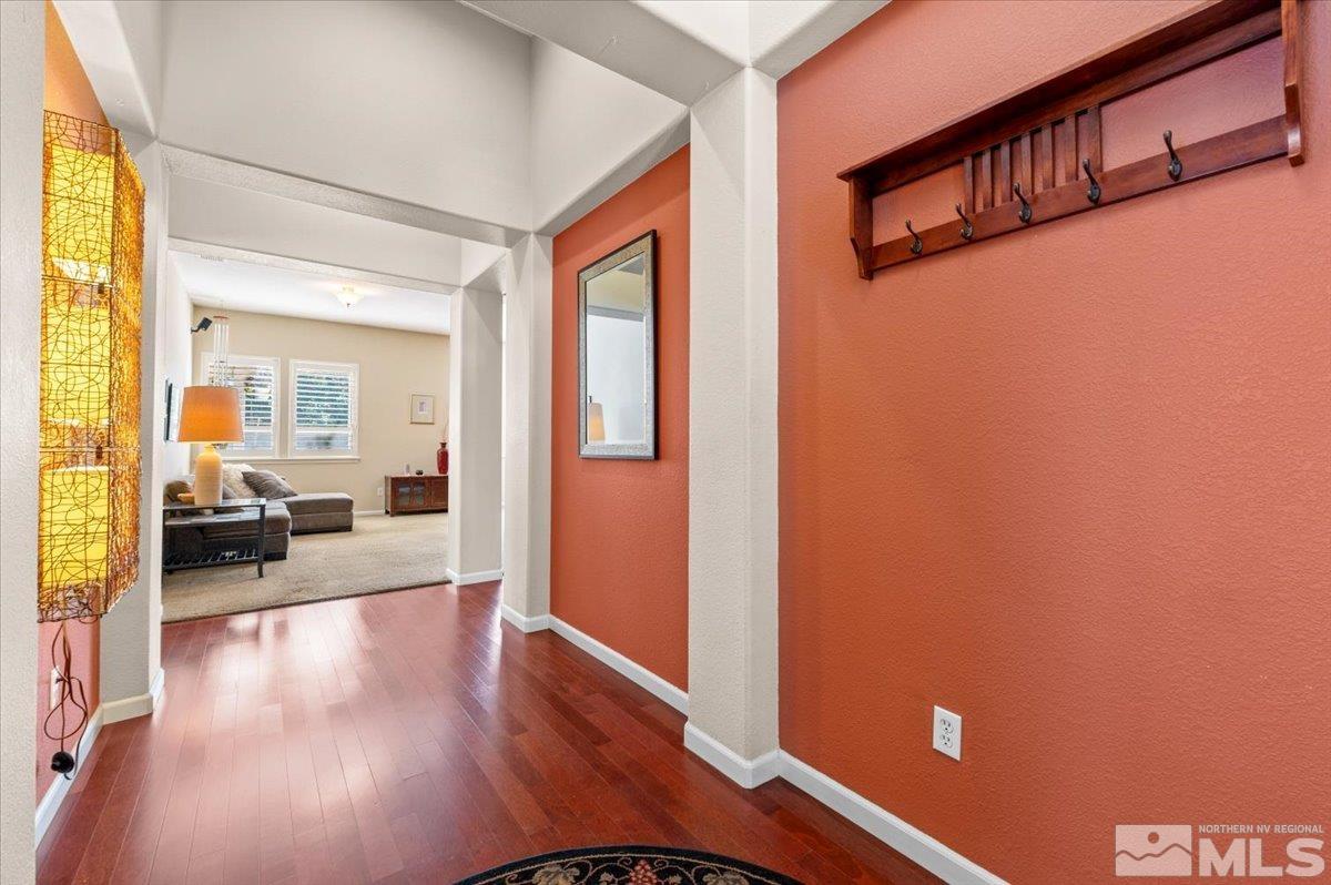 10665 Autumn Walk Lane Reno, NV 89521 - Photo 5 of 35 a view of a livingroom with wooden floor and furniture