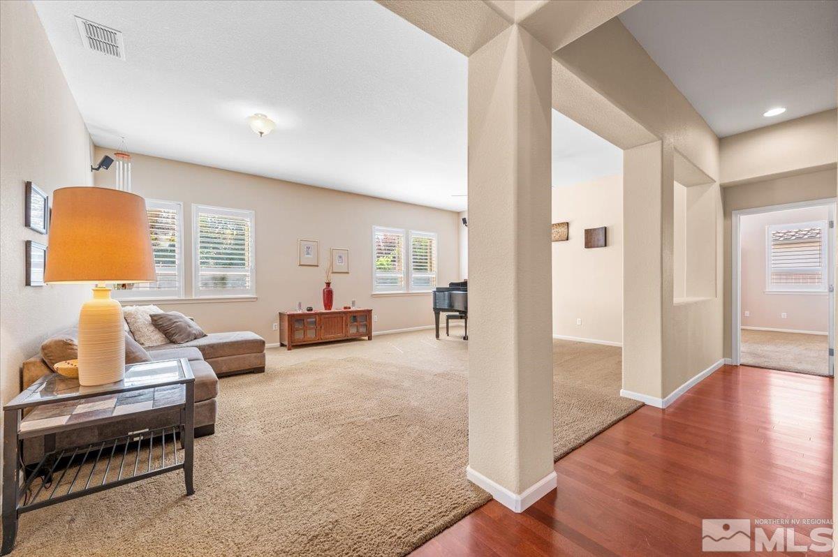 10665 Autumn Walk Lane Reno, NV 89521 - Photo 6 of 35 a living room with furniture and a lamp