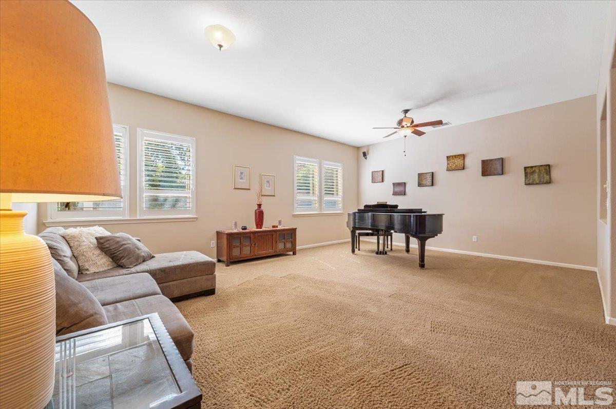 10665 Autumn Walk Lane Reno, NV 89521 - Photo 7 of 35 a living room with furniture and a large window