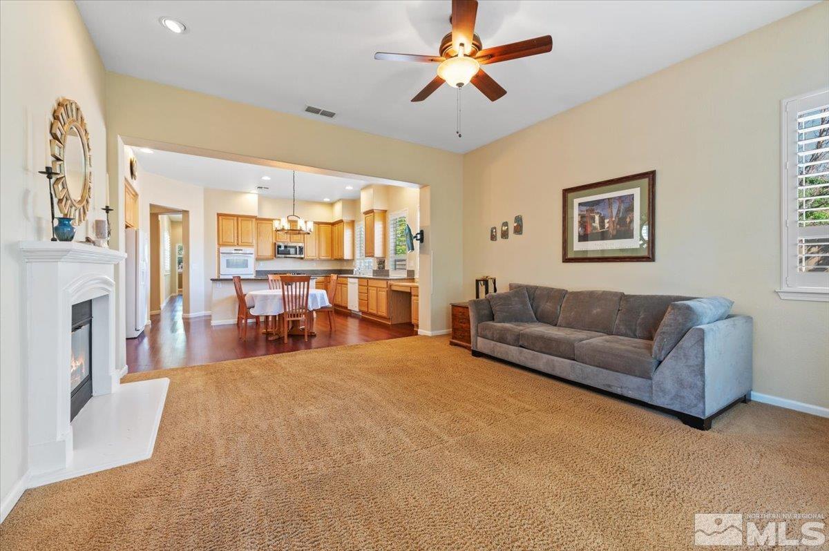 10665 Autumn Walk Lane Reno, NV 89521 - Photo 10 of 35 a living room with furniture and a fireplace