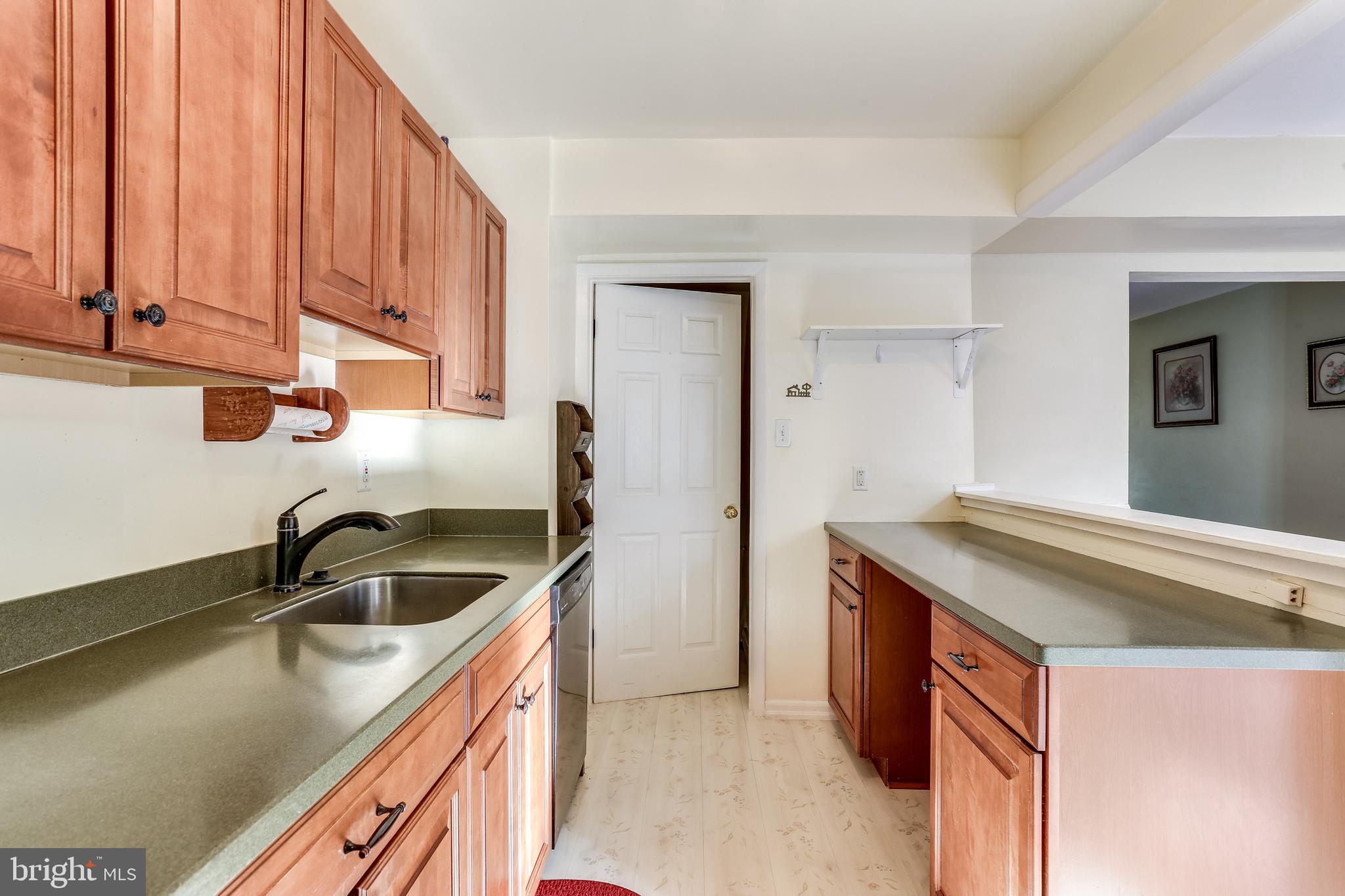 8308 Stillmeadow Road, Unit 1E Baltimore, MD 21236 - Photo 15 of 29 Kitchen w/ steps to basement
