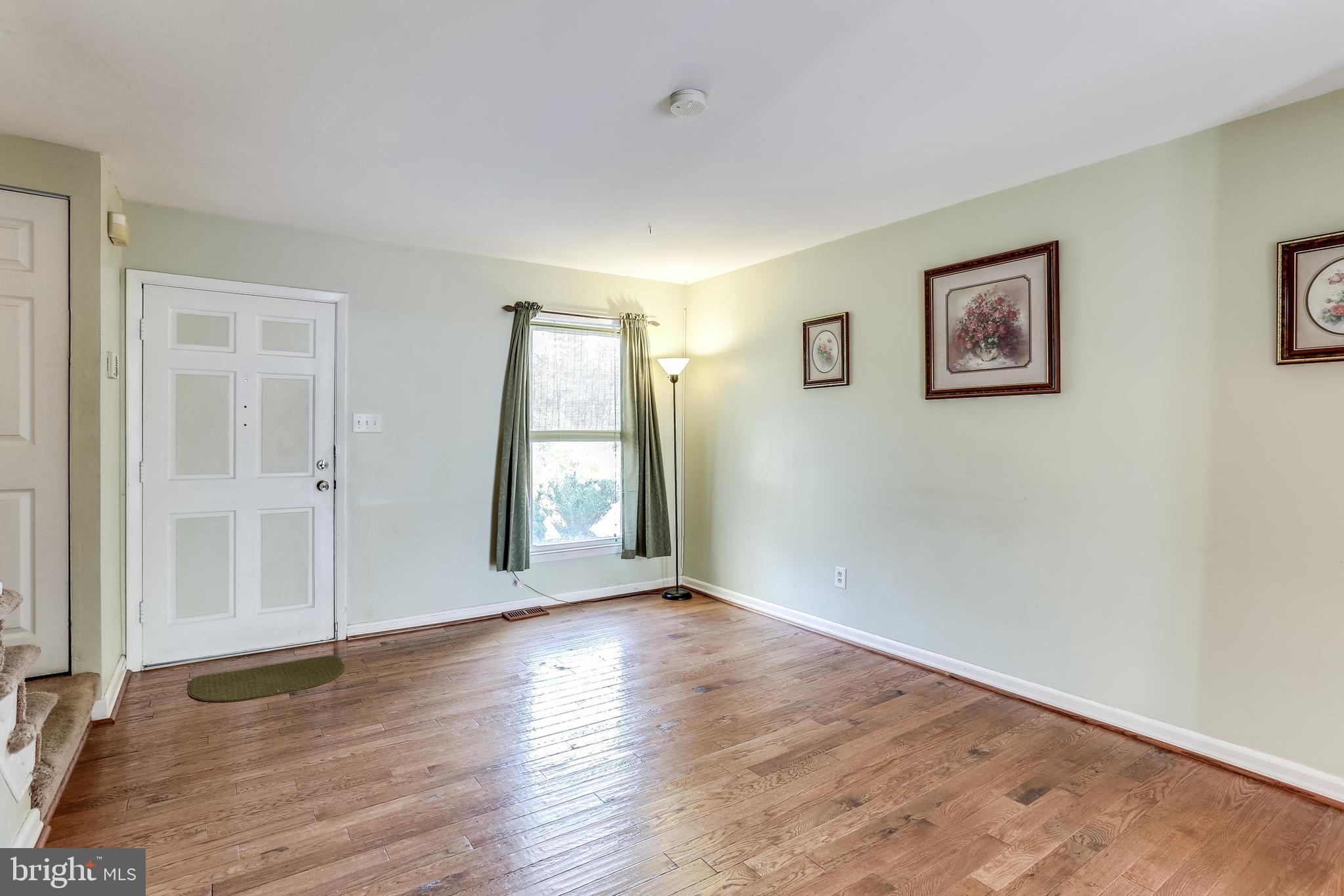 8308 Stillmeadow Road, Unit 1E Baltimore, MD 21236 - Photo 3 of 29 Living room with hardwood flooring