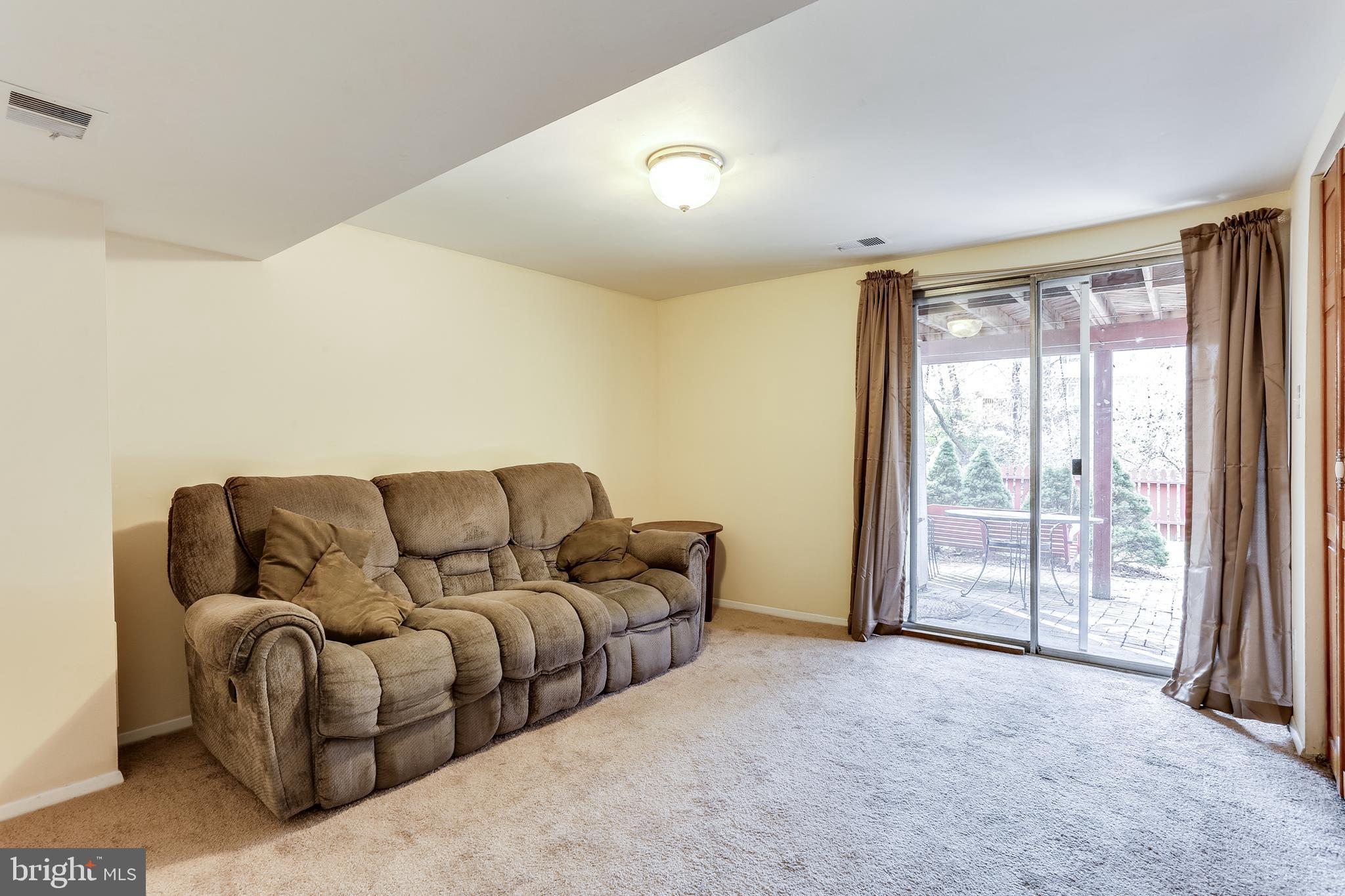 8308 Stillmeadow Road, Unit 1E Baltimore, MD 21236 - Photo 23 of 29 Lower level Rec Room w/ walkout level