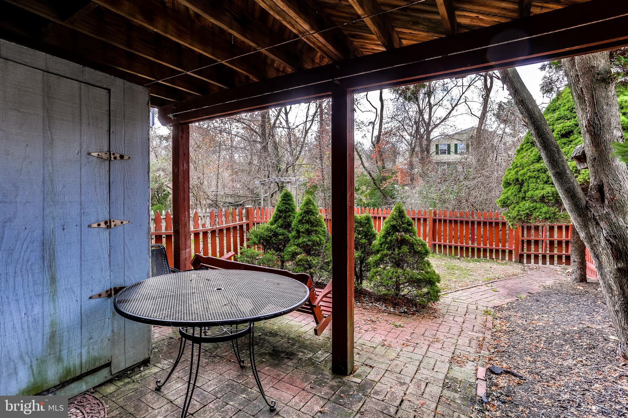 8308 Stillmeadow Road, Unit 1E Baltimore, MD 21236 - Photo 27 of 29 Rear patio w/ storage shed